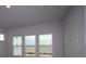 Bright bedroom with serene view from the windows providing ample natural light at 1631 Springwell Ln, Sarasota, FL 34240
