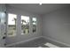 Well-lit bedroom with large windows offering serene views at 1631 Springwell Ln, Sarasota, FL 34240