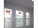 Bright room featuring three large windows that offer scenic views and ample natural light at 1631 Springwell Ln, Sarasota, FL 34240
