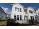 Beautiful two-story home with modern architectural details and a well-maintained front yard at 1631 Springwell Ln, Sarasota, FL 34240