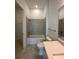 Bathroom featuring a tiled tub and shower combination with a modern vanity at 17116 Moonflower Dr, Venice, FL 34293