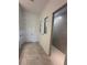 Modern bathroom showcasing a sleek tiled shower and neutral-toned flooring at 17116 Moonflower Dr, Venice, FL 34293