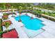 Resort-style community pool includes covered cabanas, lounge chairs, shade trees, and ample deck space at 17116 Moonflower Dr, Venice, FL 34293
