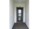 A welcoming front entry features a blue-framed glass door and neutral accents at 17116 Moonflower Dr, Venice, FL 34293