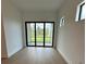 Bright, airy living space with floor-to-ceiling windows and scenic views at 17116 Moonflower Dr, Venice, FL 34293