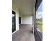 Screened patio with brick flooring and view of backyard at 17116 Moonflower Dr, Venice, FL 34293