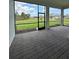 Screened-in patio featuring a brick floor with a view of the yard and a clear blue sky at 17116 Moonflower Dr, Venice, FL 34293