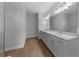 Contemporary primary bath features double sinks, quartz countertops, and modern fixtures at 1797 Pepper Grass Dr, North Port, FL 34289