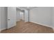 Bedroom with wood-look flooring, white walls, and white trim at 1797 Pepper Grass Dr, North Port, FL 34289