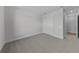 Bedroom featuring carpeted flooring and a double-door closet at 1797 Pepper Grass Dr, North Port, FL 34289