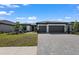 Charming single-Gathering home with a tile roof, two-car garage, and a well-maintained front yard at 1797 Pepper Grass Dr, North Port, FL 34289