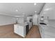 Spacious kitchen with a large center island, stainless steel appliances, and modern fixtures at 1797 Pepper Grass Dr, North Port, FL 34289