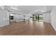 Bright, open-concept living space featuring modern kitchen, tile floors and sliding glass doors to the outdoors at 1797 Pepper Grass Dr, North Port, FL 34289
