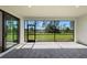 Cozy outdoor patio offering peaceful views of the well-maintained backyard at 1797 Pepper Grass Dr, North Port, FL 34289