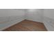 Walk-in closet with wood-look flooring and wire shelving at 1797 Pepper Grass Dr, North Port, FL 34289