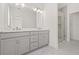 Bathroom with double sinks, vanity, and a glass-enclosed shower at 2019 Wild Heron Ct, Valrico, FL 33596