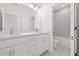 Bathroom with double sinks, large mirror, and combination shower/tub at 2019 Wild Heron Ct, Valrico, FL 33596