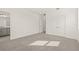 Spacious bedroom with double doors, carpet flooring, and natural light at 2019 Wild Heron Ct, Valrico, FL 33596