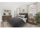 Comfortable bedroom with natural light, a dresser, and modern decor at 2019 Wild Heron Ct, Valrico, FL 33596