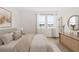 Bedroom with plenty of natural light, hardwood floors, and dresser with decor at 2019 Wild Heron Ct, Valrico, FL 33596
