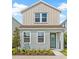 Charming two-story home with a well-manicured lawn and inviting entryway at 2019 Wild Heron Ct, Valrico, FL 33596