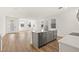 Modern kitchen with a center island, sleek countertops, and wood flooring at 2019 Wild Heron Ct, Valrico, FL 33596