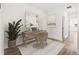 Bright office area with a modern desk, decor, and a houseplant at 2019 Wild Heron Ct, Valrico, FL 33596