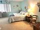 Bright, airy bedroom featuring carpeted floors, closet, and lots of natural light at 2101 Sunset Point Rd # 205, Clearwater, FL 33765