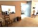 A quaint living area featuring neutral walls, cozy carpeting, and an open floor plan at 2101 Sunset Point Rd # 205, Clearwater, FL 33765