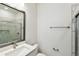 Modern bathroom with a walk-in shower, white vanity, and chrome fixtures at 2123 1St N Ave, St Petersburg, FL 33713