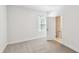 Bright bedroom featuring large windows and neutral carpet at 2123 1St N Ave, St Petersburg, FL 33713