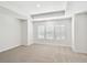 Bright and spacious bedroom with neutral carpeting and large windows at 2123 1St N Ave, St Petersburg, FL 33713