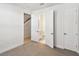 Bright bedroom featuring neutral carpet and ample closet space at 2123 1St N Ave, St Petersburg, FL 33713