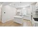 Bright, modern kitchen featuring an island, stainless steel appliances, and sleek white cabinets at 2123 1St N Ave, St Petersburg, FL 33713