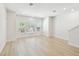 Bright living room featuring big windows and light wood flooring at 2123 1St N Ave, St Petersburg, FL 33713