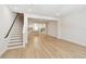 Open concept living room and staircase, view into the kitchen at 2123 1St N Ave, St Petersburg, FL 33713