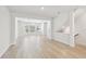 Open concept living room with large windows and light wood flooring at 2123 1St N Ave, St Petersburg, FL 33713