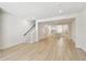 View of the open-concept living room and kitchen. Staircase on left at 2123 1St N Ave, St Petersburg, FL 33713