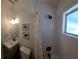 Clean bathroom features a modern vanity, fresh paint, and a shower at 2204 Euclid S Cir, Clearwater, FL 33764