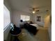 Cozy bedroom features a ceiling fan and natural light, creating a relaxing atmosphere at 2204 Euclid S Cir, Clearwater, FL 33764