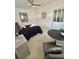 Neutrally painted bedroom featuring a ceiling fan, a closet with sliding doors, and simple decor at 2204 Euclid S Cir, Clearwater, FL 33764