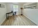 Bright bedroom with new floors, a desk and chair, and a contemporary art piece at 2204 Euclid S Cir, Clearwater, FL 33764