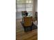 Cozy dining area features a round glass table and three upholstered chairs with a neutral rug at 2204 Euclid S Cir, Clearwater, FL 33764