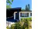 Inviting home with carport, modern design, and fresh landscaping at 2204 Euclid S Cir, Clearwater, FL 33764
