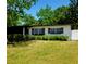 This home boasts fresh landscaping, and a sleek, modern design at 2204 Euclid S Cir, Clearwater, FL 33764
