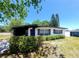 Charming home with a carport, fresh landscaping, and a modern design at 2204 Euclid S Cir, Clearwater, FL 33764