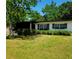 Charming single-story home with a well-manicured lawn and beautiful mature trees at 2204 Euclid S Cir, Clearwater, FL 33764