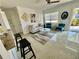 Bright and airy living room with stylish furnishings, a ceiling fan, and decorative accents at 2204 Euclid S Cir, Clearwater, FL 33764
