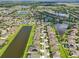 Expansive aerial view of a neighborhood with multiple lakes and lush landscaping between residences at 2417 Cumberland Cliff Dr, Ruskin, FL 33570
