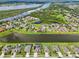 Gorgeous aerial view featuring a lakefront community with private pools and lush green landscaping at 2417 Cumberland Cliff Dr, Ruskin, FL 33570